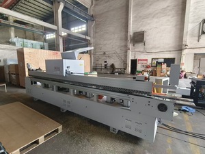 Machine de chantournage automatique certifiée CE pour cadres de portes robustes avec rainurage intégré et scellement des bords en PUR - Product Image 4