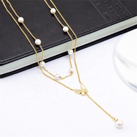 Collier Double couche en acier inoxydable pour femmes, bijoux tendance, en plaqué or, breloque perle et papillon, pendentif avec pompon, nouvelle collection