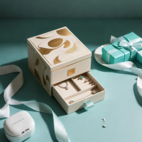 Boîte à bijoux haut de gamme à double couche avec tiroir, texture gaufrée or, papier spécial coloré transparent, boîtes de support intérieures en MDF