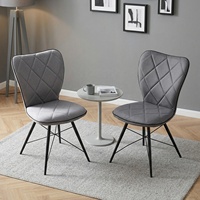 Chaise de salle à manger grise moderne avec dossier ergonomique, assise rembourrée matelassée et pieds en acier noir pour la fourniture de mobilier B2B