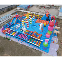Grand parc aquatique gonflable en forme d'éléphant avec entrée double éléphant et parcours d'obstacles interactif pour les centres de divertissement aquatique