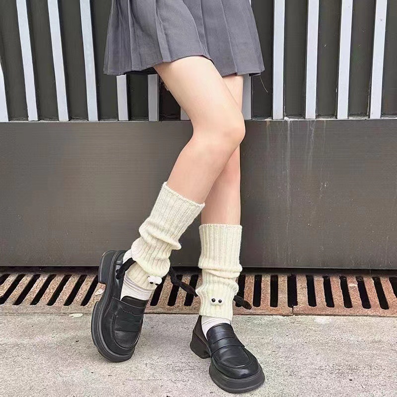 White hand-holding socks
