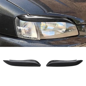 Pegatinas de fibra de carbono estilo deportivo para faros delanteros (cejas) para Toyota Starlet Glanzer EP91 (modelos 1997+) - Product Image 1