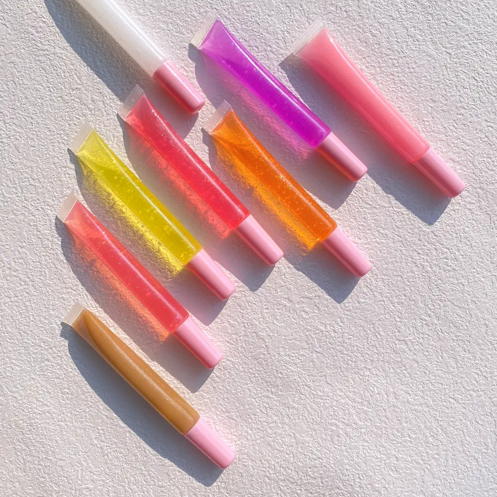 Großhandel benutzer definierte Logo Squeeze Tube Kristall Lip gloss flüssiges Öl 15ml große Kapazität bunten Schlauch Lip gloss für den Sommer