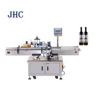 Machine de remplissage de liquides entièrement automatique pour petits volumes, machine de bouchage, machine d'étiquetage, bouteilles, canettes, verre, métal, film, haute précision