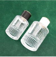 Flacon de parfum en verre cylindrique rechargeable de luxe personnalisé de 100 ml, transparent, vide, avec vaporisateur à pompe et boîte