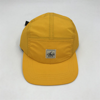 Chapeau imperméable en nylon à 5 panneaux avec écusson d'étiquette personnalisée Chapeaux en gros avec étiquette personnalisée sur le devant