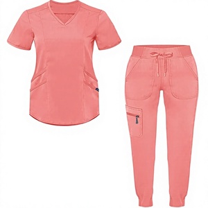 เสื้อสครับคอวีสีเบจแบบยูนิเซ็กซ์ มีกระเป๋าด้านหน้าและตำแหน่งสำหรับใส่โลโก้ เหมาะสำหรับใช้ในโรงพยาบาล - Product Image 1