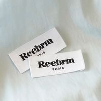 Étiquette en coton blanc imprimé, écologique et douce pour la peau, durable pour le lavage, logo personnalisé disponible