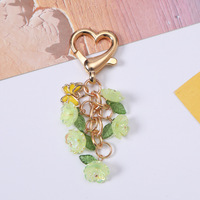 Vente en gros usine Nouveau porte-clés en émail avec fleur d'orchidée papillon et perle, breloque de sac à main style frais, bijoux assortis pour meilleures amies