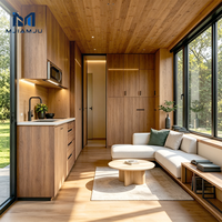 Maison préfabriquée modulaire moderne en acier à deux étages avec balcon et escalier en colimaçon pour un salon élégant