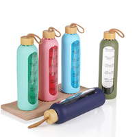 Bouteille d'eau moderne et motivante pour enfants de 32 oz en verre borosilicate avec manchon en silicone sans BPA et marqueur de temps