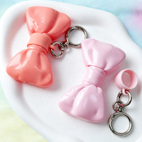 Gloss à lèvres en forme de nœud, corps opaque brillant, flacons à nœud ruban, tons corail et rose, applicateur doe foot floqué, approvisionnement en gros, logo personnalisé, OEM