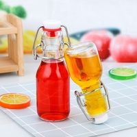 Botol kaca wadah minuman Swing Top dengan produsen Mini 100 60ml Flip