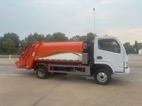 Camion Compacteur de Déchets d'Occasion Euro 3 Dongfeng 4X2 avec Boîte de Vitesses Manuelle, Moteur Diesel, Télécommande, Bac à Déchets 10-12m, Exportation