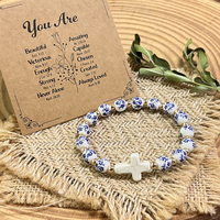 Nouveau style de bijoux ethniques chinois pour femmes, perles en céramique bleues et blanches de 8 mm, bracelet élastique en turquoise avec croix