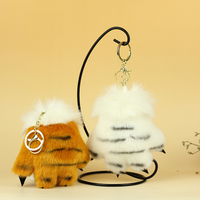 Vente en gros de mini peluches simulant une patte de tigre, pendentif en peluche avec griffe d'ours en léopard, jouets en peluche OEM ODM pour cadeau