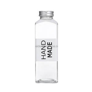 Vente en gros Cmugr1 litre bouteille en verre 12oz 14oz 16oz bouteille de jus boisson carré clair bouchon à vis bouteilles en plastique pour jus BAIDE - Product Image 6