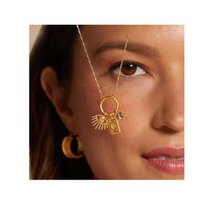 Elegante oro placcato 18K in acciaio inox Sun Devil Eye luna 12 pietre natale ciondolo collana - Product Image 1