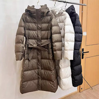 Nouvelle veste longue ajustée pour femme, collection automne/hiver, avec capuche, ceinture cintrée, en fibre de polyester et duvet de canard blanc, pour l'export.