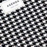Agenda 2026-2027 avec couverture en tissu tissé pied-de-poule, reliure spirale dorée, sangle élastique et intercalaires