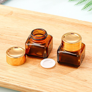 ขวดแก้วสีน้ำตาลกันแสงขนาด 20 กรัม รูปทรงสี่เหลี่ยม สำหรับครีมบำรุงรอบดวงตา ปิดผนึกด้วยฝาเกลียว พิมพ์ลาย <span class=keywords><strong>VKK</strong></span> รุ่นบรรจุภัณฑ์เครื่องสำอาง - Product Image 3