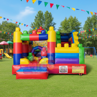 Château gonflable combiné toboggan et structure à blocs colorés, thème briques arc-en-ciel, pour fêtes d'enfants et location commerciale