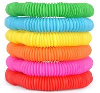 Jouet amusant et éducatif pour soulager le stress, tube pop, jouet en plastique miniature télescopique ondulé multicolore