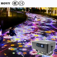 Projecteur de sol interactif créatif pour l'extérieur avec design portable et léger et haut-parleur intégré pour une expérience magique