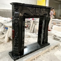 Cheminée en marbre noir de conception moderne sculptée à la main pour la décoration intérieure