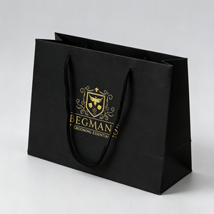 Sacs de shopping en papier kraft noir recyclables, personnalisés avec logo imprimé et estampage à chaud doré, pour emballage promotionnel de vêtements et cadeaux de détail - Product Image 1