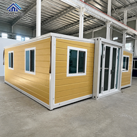 Casa Container Espandibile Gialla Personalizzabile con Telaio Bianco a T, Doppia Porta in Vetro, Completamente Arredata, con Cucina e Magazzino