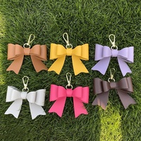 Porte-clés élégant en cuir PU nœud papillon mignon sac breloque accessoire voiture ornements suspendus porte-clés porte-clés