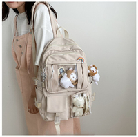 2022 à la mode dessin animé poupée designer logo personnalisé adolescent cartable livre sacs décontracté sacs d'école femmes sac à dos pour collège fille