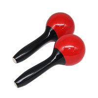 Maracas rouges brillants avec poignées noires, bords lisses, finition découpée au laser pour un son clair