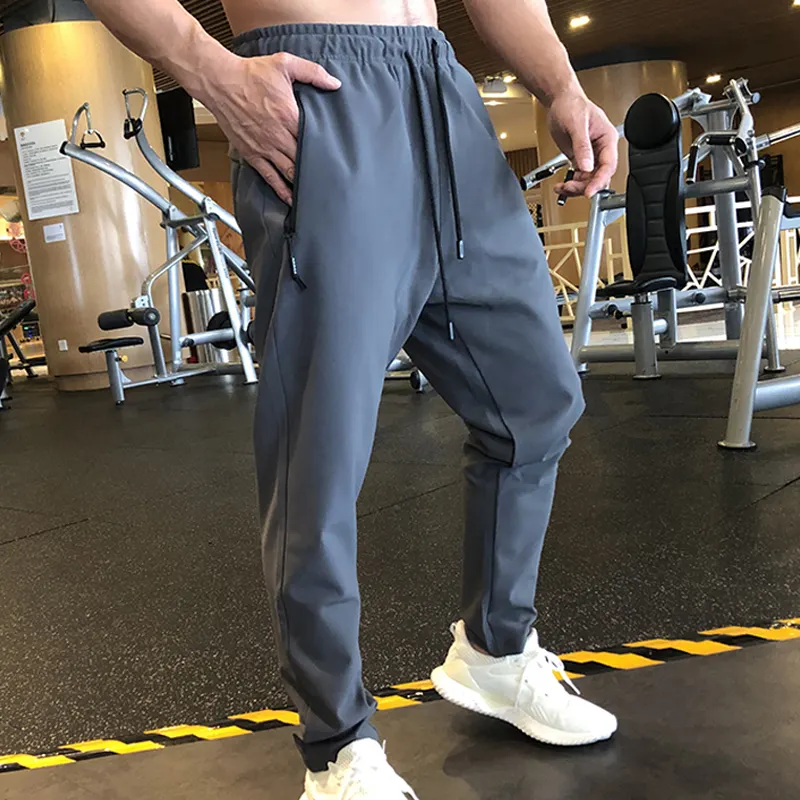 Erkekler spor pantolonlar koşu egzersiz koşucu pantolonu hızlı kuru eğitim naylon Sweatpants yüksek kalite spor dipleri