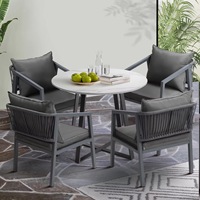 Table et chaises d'extérieur en pierre de style luxe léger, ensemble de table et de chaises de salon de jardin