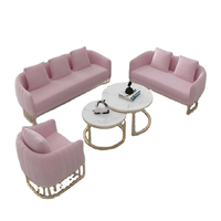 Style nordique simple moderne petite famille magasin de vêtements canapé lumière luxe métal canapé table basse combinaison loisirs canapé chaise