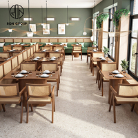 Ensemble table et chaises en rotin design moderne, siège de stand luxueux pour les restaurants.
