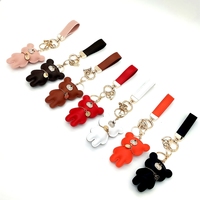 Porte-clés de luxe en cuir PU marron, petit porte-clés Bling, ours, avec pompon, vente en gros