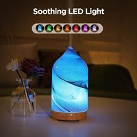 Diffuseur d'huiles essentielles électrique en verre effet roche sablée avec 7 lumières LED pour une utilisation intérieure à la maison