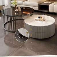 Table basse ronde moderne de luxe en pierre frittée aspect marbre avec tiroirs, rotation à 360°, meuble de salon durable