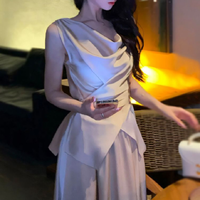 Ensemble jupe taille haute amincissante et débardeur sans manches de style français, luxe léger et tendance pour femme, Nouvelle collection 2026