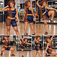 Ensemble d'entraînement uniforme de majorette personnalisé bleu marine et orange à motif léopard, comprenant un débardeur dos nageur et un short moulant, pour HBCU Battle Squad