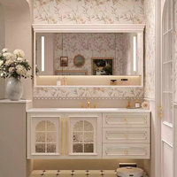 Ensemble de meuble-lavabo mural XINGRUO de style français vintage en chêne laqué avec miroir intelligent et lavabo monobloc en céramique effet pierre.