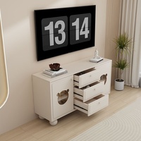Grand meuble TV minimaliste moderne en style crème Rangement tendance pour petits appartements Table basse sur pied