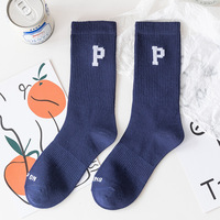 Chaussettes de sport en coton pour femmes, couleur unie tendance, printemps et automne, lettres noires et blanches, mi-mollet, style streetwear
