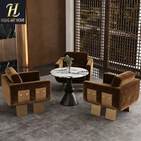 Fauteuil de salon sur mesure haut de gamme en cuir noir avec accent en métal liquide pour hôtel, villa, salon