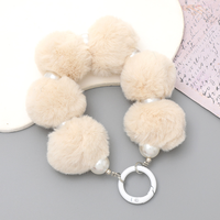 Cordon de téléphone perlé avec pompon, dragonne en peluche moelleuse, jolie chaîne décorative à suspendre pour téléphone portable, clés, sac à main