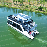 Bateau-maison flottant en aluminium de 12 m avec bar, barbecue et cuisine climatisée, idéal pour la location ou comme restaurant aquatique.